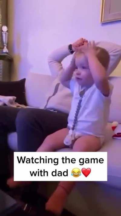 Watching the game with dad