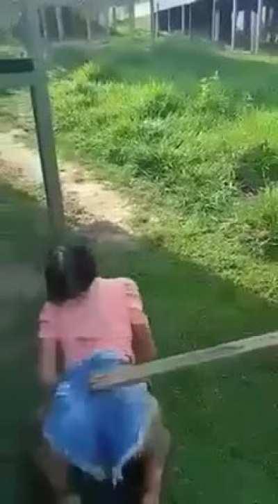 Girl gets beat with two 2x4s and takes it like a champ.