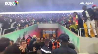 Salah escorted to the dressing room after Senegal fans invaded the pitch