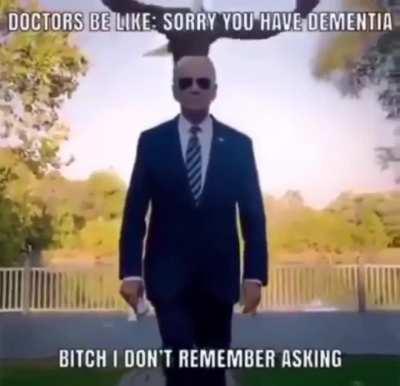 Joe Biden walking with Miss The Rage in background