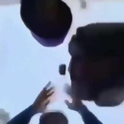 3 People with 1 pot in the air