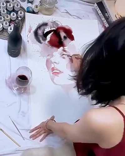 Girl makes art using wine spills