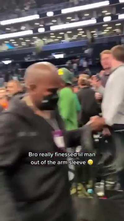 Dude steals an arm band from a kid