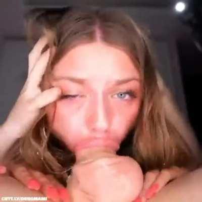 Using her mouth