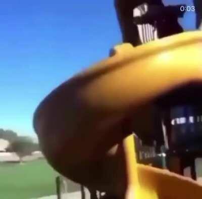 While I ride down this slide, on a bike..