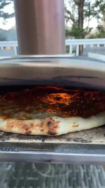 Bubbling cheese pizza in the Ooni!