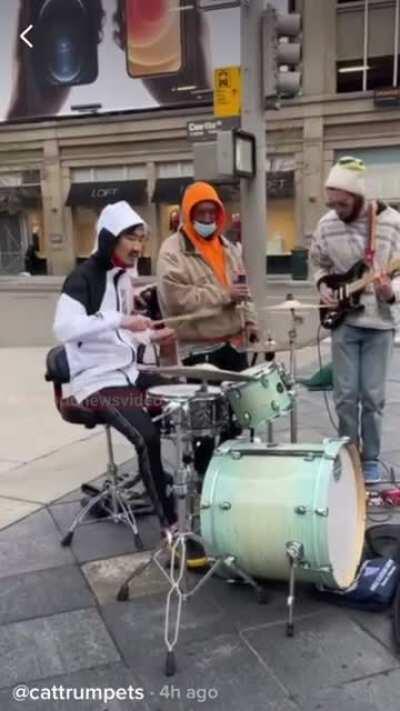Men decide to play fisticuffs while a band jams out