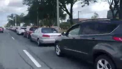 Video of cars lining up to receive free Frankie Tomatto's pizza Saturday aug 29 2020