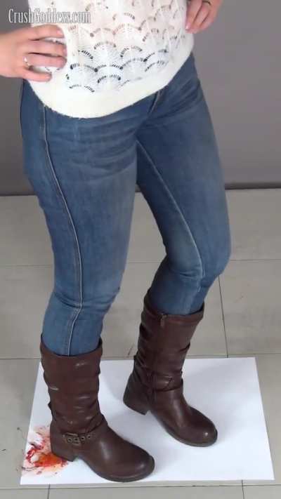 Lena crushes the fish with the heel of her boot.
Her sexy jeans and hips also excite me.