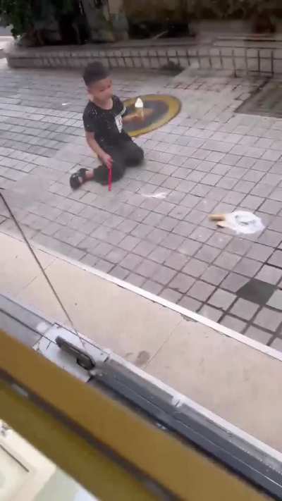 The kid deliberately stepped on the ice cream for no reason.