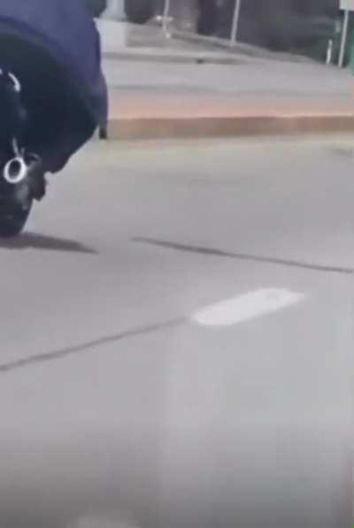 Dude is not only breaking traffic laws but the laws of physics.