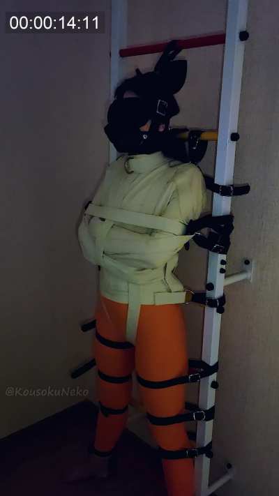 Timelapse of standing and struggling in a straitjacket
