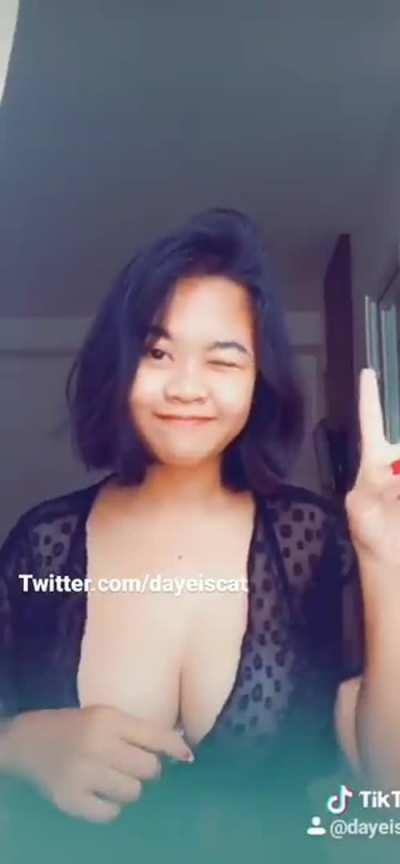 Boobs spilling out of her top