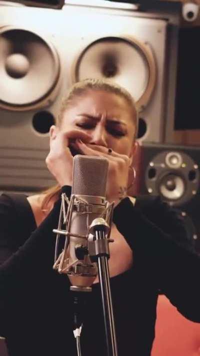 Indiara Sfair playing harmonica