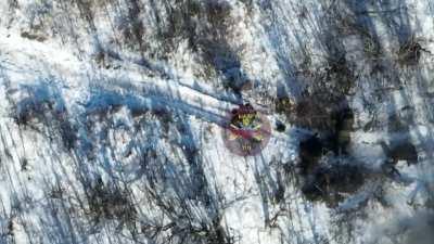 A Russian infantry group stop briefly to rest and are hit directly by a Ukrainian drone.