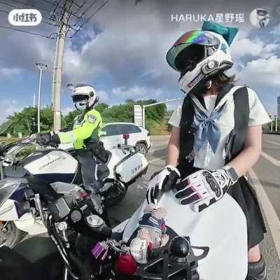 When a Chinese traffic cop pulls up next to you.