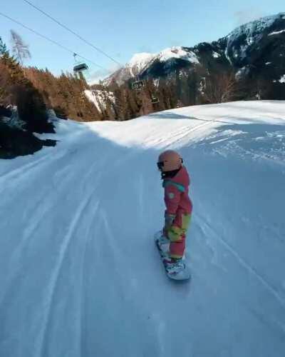 4-year-old girl snowboarding