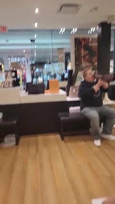Bootlicker licking a shoe in a store - Kitchener Ontario