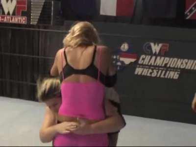 The bigger girl torments the poor blonde jobber as she completely destroys her with submissions including unnecessary chokes and strangles