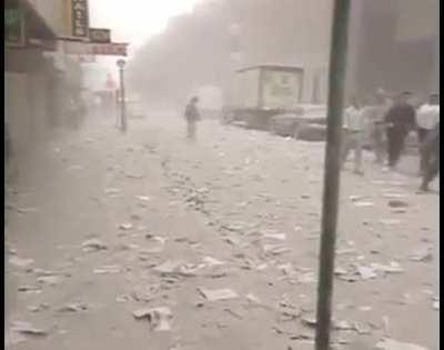 This is the moment crowds of the public started running for shelter as the the first plane hit the One World Trade Center on September 11th, 2001 in New York.
