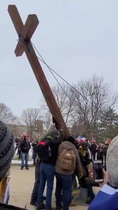 Trump Coup mob erect a crucifix outside the capitol building.