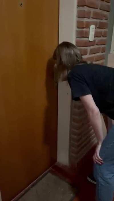 This woman was locked outside and the cat opened the door for her