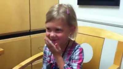 kid with hearing loss hears her voice for the first time