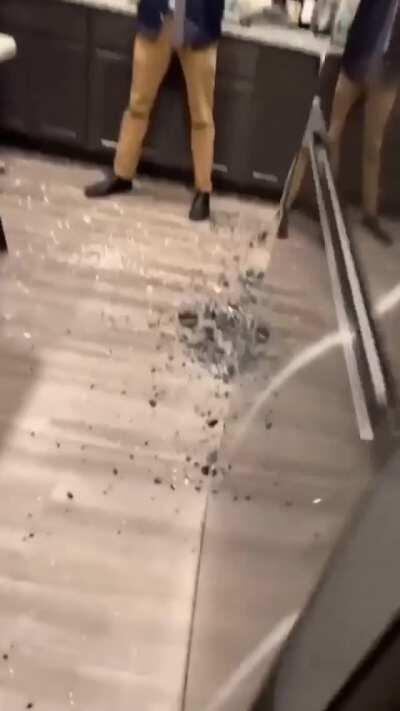 Piece of the ceramic plate broke the tempered glass.