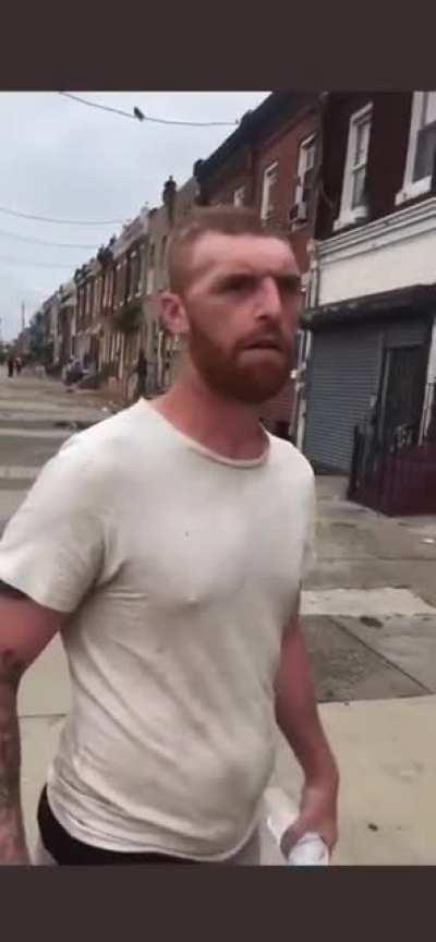 Man with what appears to have had a previous, serious head injury treated like a museum display after asking for money. Possibly homeless.