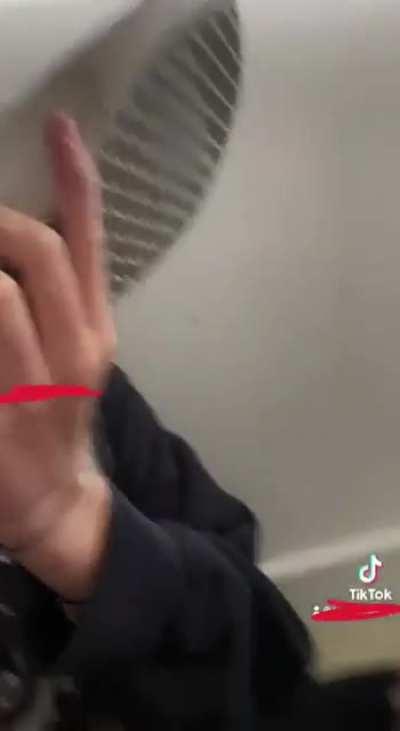 My friend watches me smell her shoes