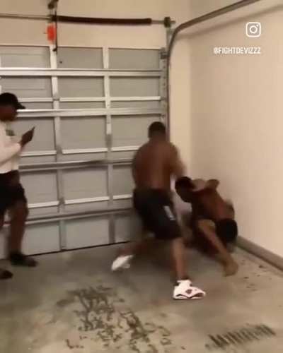 Just a couple of black guys… settling their differences… in a garage 😒