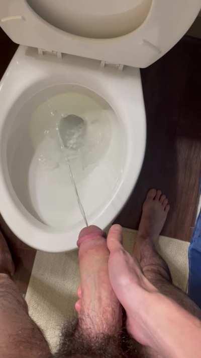 Pissing after a jack off session