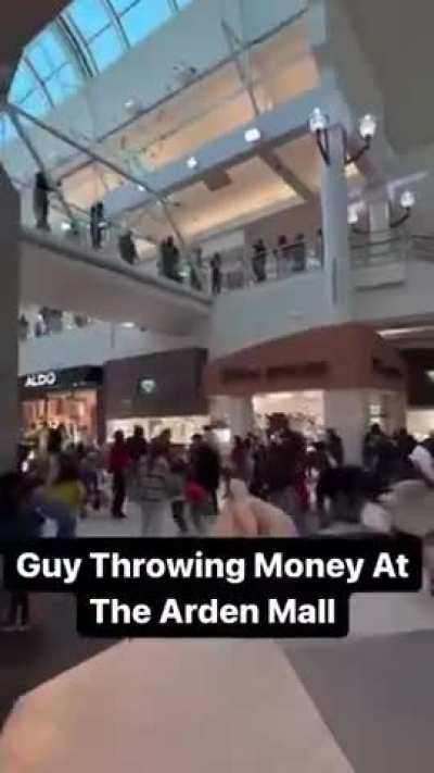 Merry Christmas from Sacramento. Man gives out money at a mall in Sacramento 