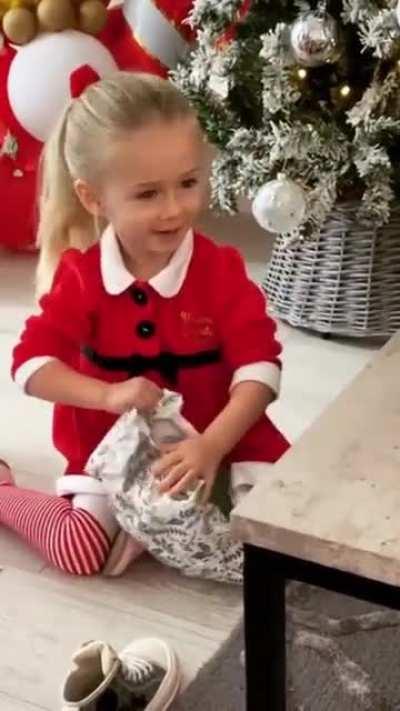 This little girl gets broccoli for Christmas