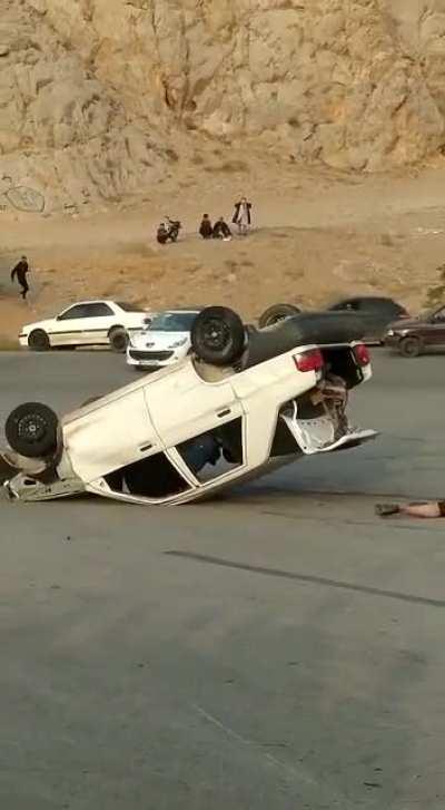 [NSFW] car rolls over with a guy hanging out of the window