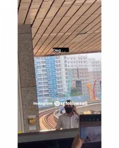 Boy climbs onto train tracks