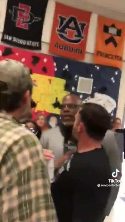 Racist MAGA dumbfuck threatens black kid during heated argument over CRT