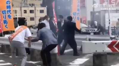 Former Japanese Prime minister Shinzo Abe getting shot.