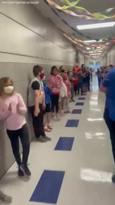 Students and staff at an Oklahoma elementary school lined the hallways to cheer for their school cafeteria manager who passed her test to become a U.S. citizen
