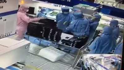 Chinese Workers Stand Still Like Robots While Fellow Co-Worker Tries To Kill Another Assassin’s Creed Style!