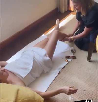 Having her legs moisteurized