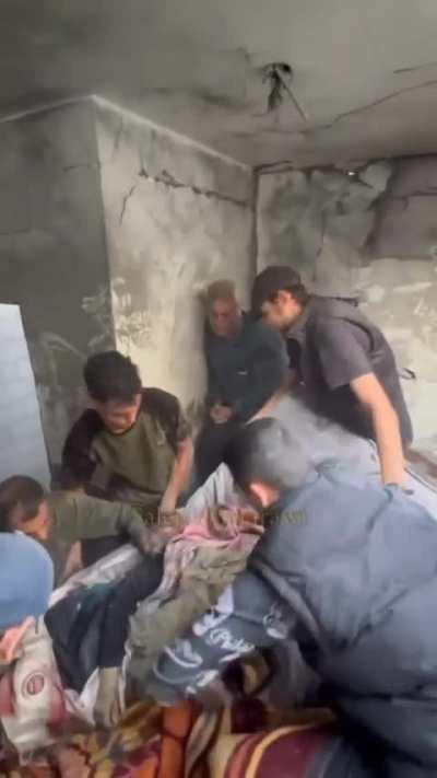 A Palestinian mourns his mother who was martyred after the israeli occupation forces bombed the family's home