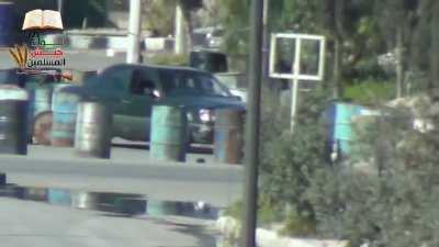 An Army of the Muslims Brigade sniper shoots at an alleged Syrian Army Officer while he driving his car Damascus (March 2013)