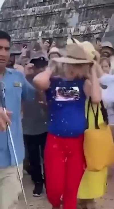 In Mexico, a tourist climbed and danced on a sacred Mayan pyramid and then got attacked by a mob of locals.