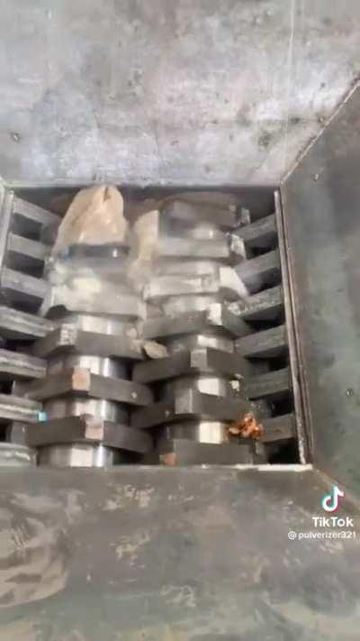 A crusher crushing a rock