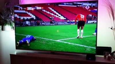 Player realized he is outside the pitch and play will not be halted so he rewinds a little