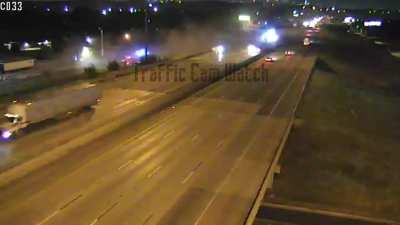 Tractor Trailer Rolls Off Interstate, Nearly Missing A Prior Accident Scene In Alabama