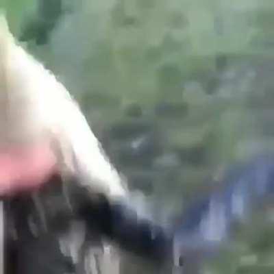 Guy throws gator into lake