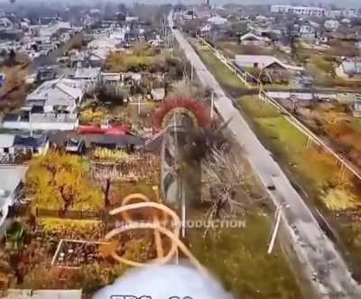 RU POV: UAF armored vehicle runs past fiber-optics FPV drone, but operator takes a shortcut through town to end up right in front of the vehicle to strike it. 
