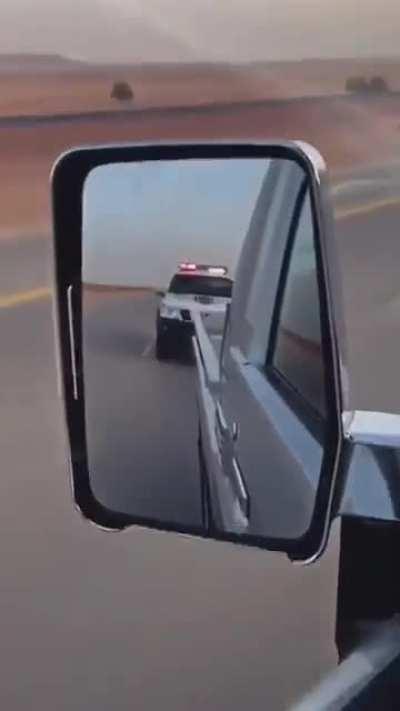 Going 200kph while being followed by a police car.
